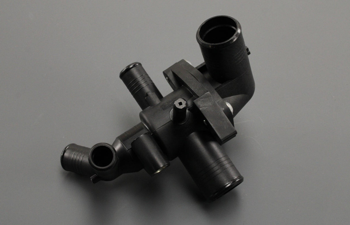 Land Rover Defender 2.4L Puma thermostat housing LR004656