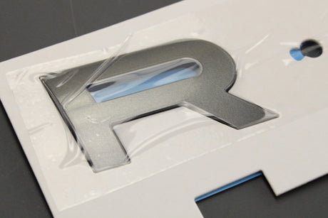 Range Rover Evoque 2019-on 'RANGE' badge emblem (front) LR162796