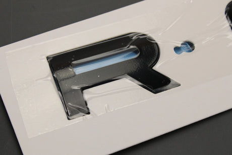 Range Rover Evoque 2019-on 'ROVER' badge emblem (front) LR162799