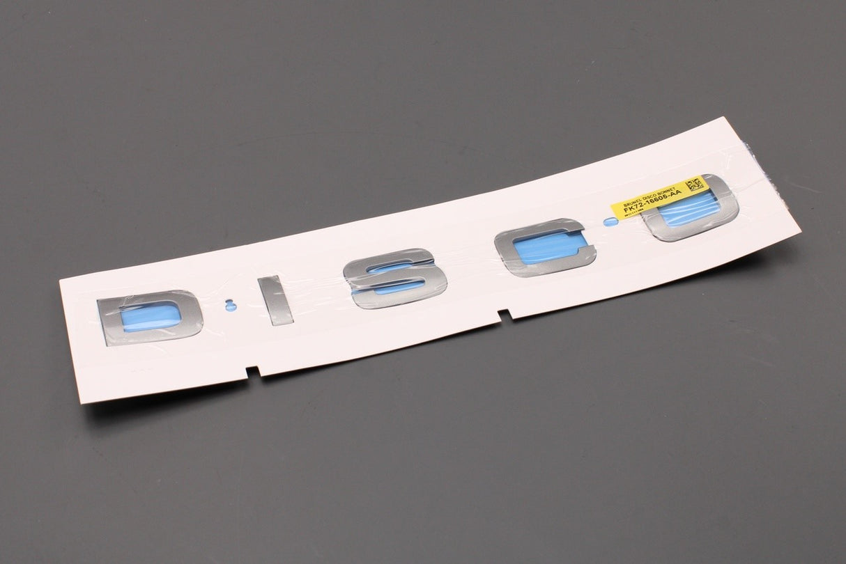 Land Rover Discovery Sport 2015-on 'DISCO' badge (front) LR063638