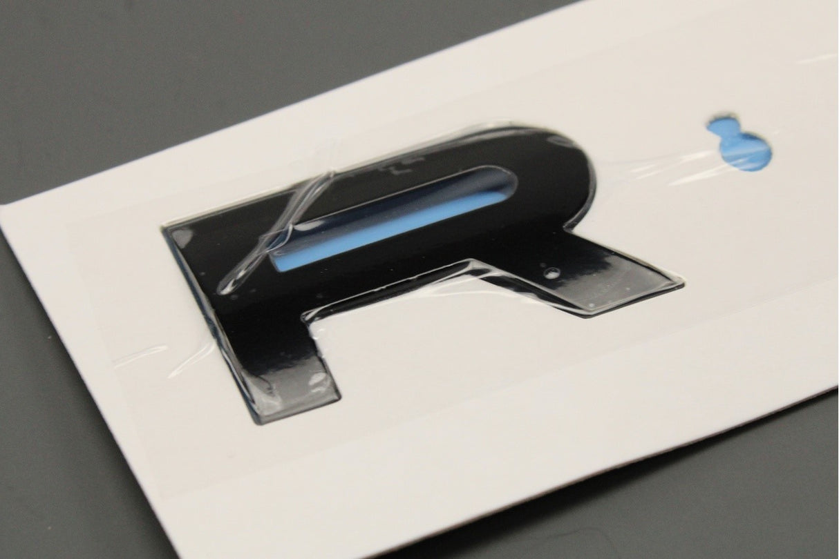 Land Rover Range Rover Sport 23-on black "Rover" badge (front) LR168911