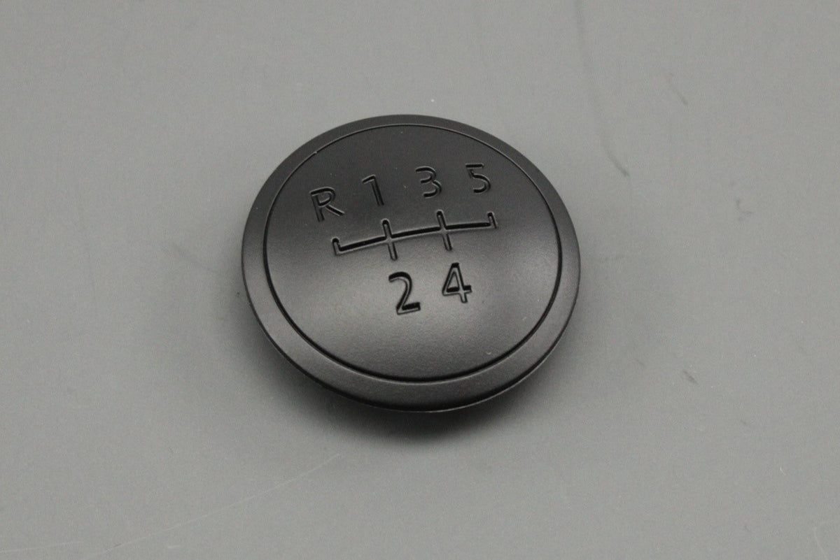 VW Transporter T5.1 T6 gear knob badge cap (5-speed) 7E0711144G 9B9, view 1