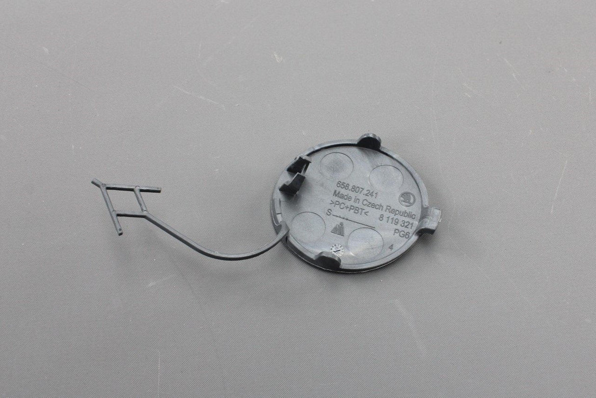 Skoda Scala Kamiq front bumper towing eye cover trim (primed) 658807241