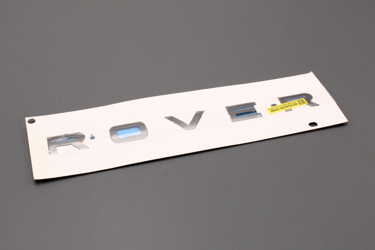 Range Rover Velar 2017-on rear 'ROVER' badge emblem LR154636, view 1