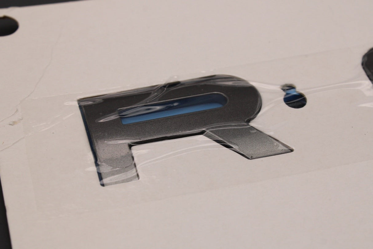 Range Rover Velar 2017-on rear 'ROVER' badge emblem LR154636