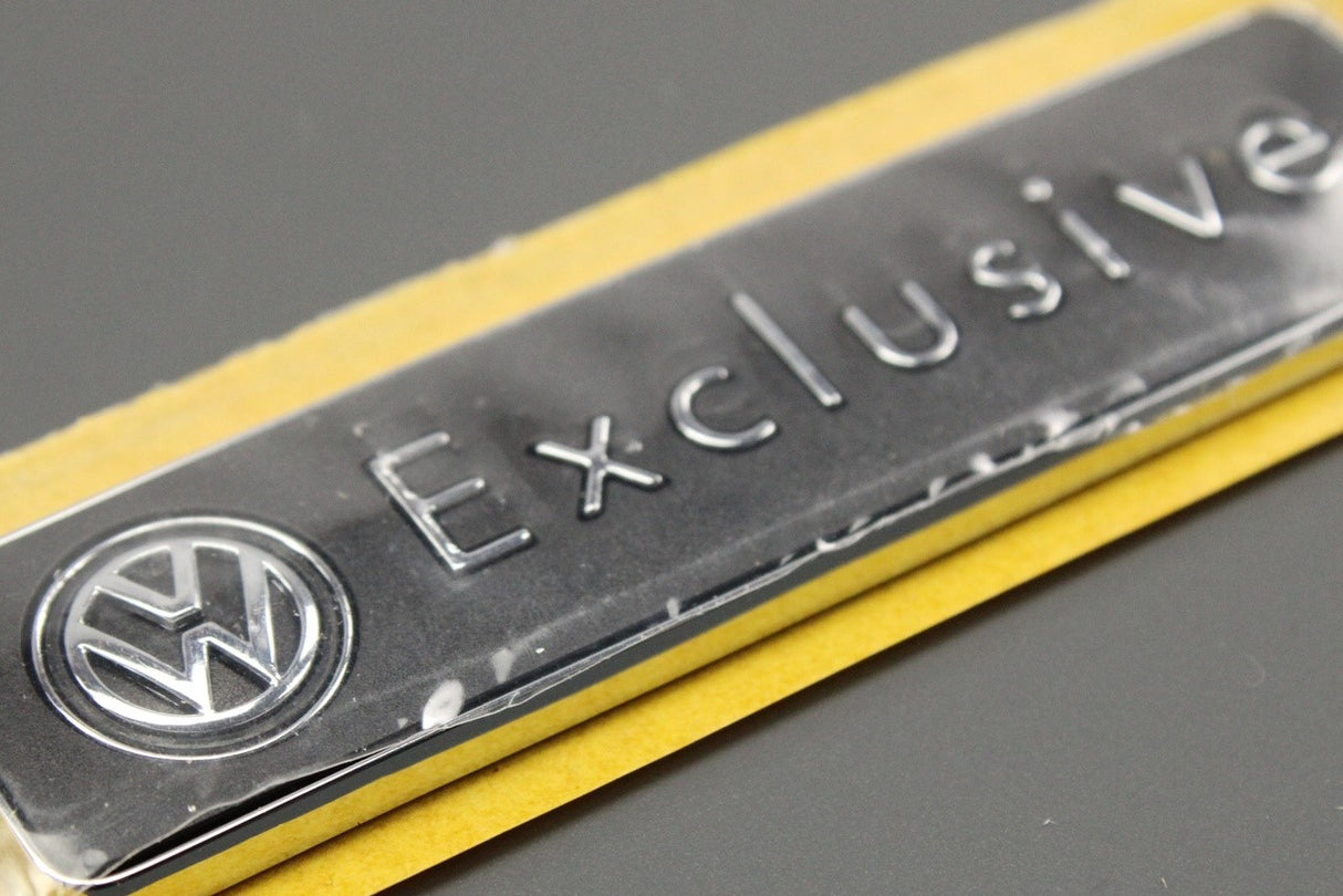 VW Exclusive emblem badge 1K0853688F 739