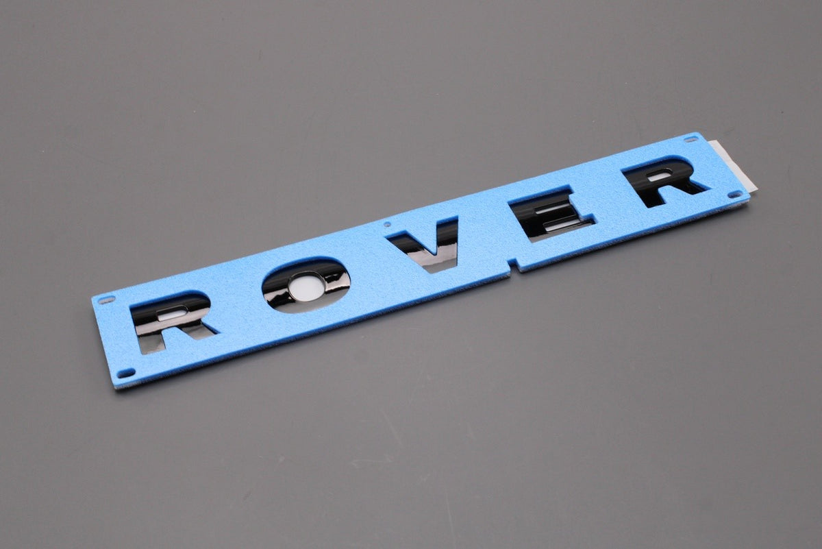 Land Rover Defender 2007-2016 'ROVER' front badge emblem LR025839, view 1